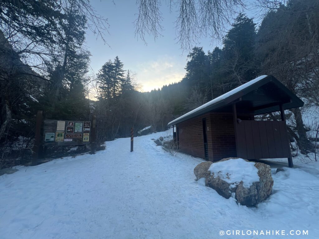 Trailhead sign and restroom building at Mill B South trailhead in Big Cottonwood Canyon