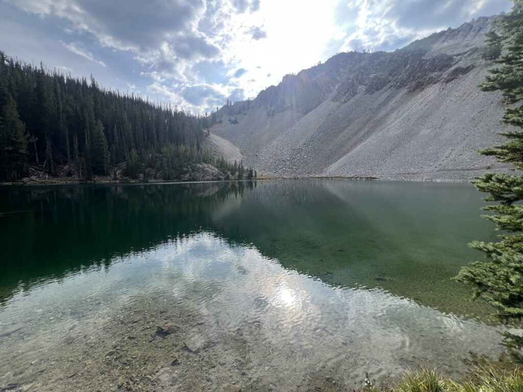 Crystal-clear Lower Norton Lakes surrounded by rugged peaks and wildflowers in Idaho.